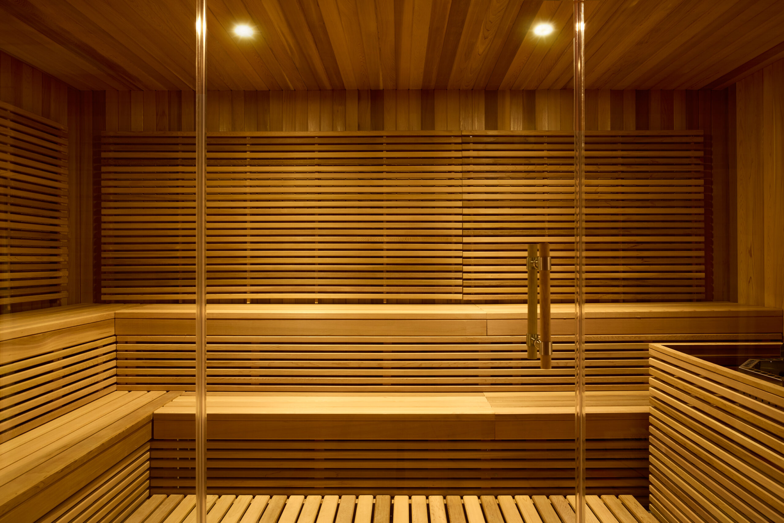 warmly lit, all wood sauna