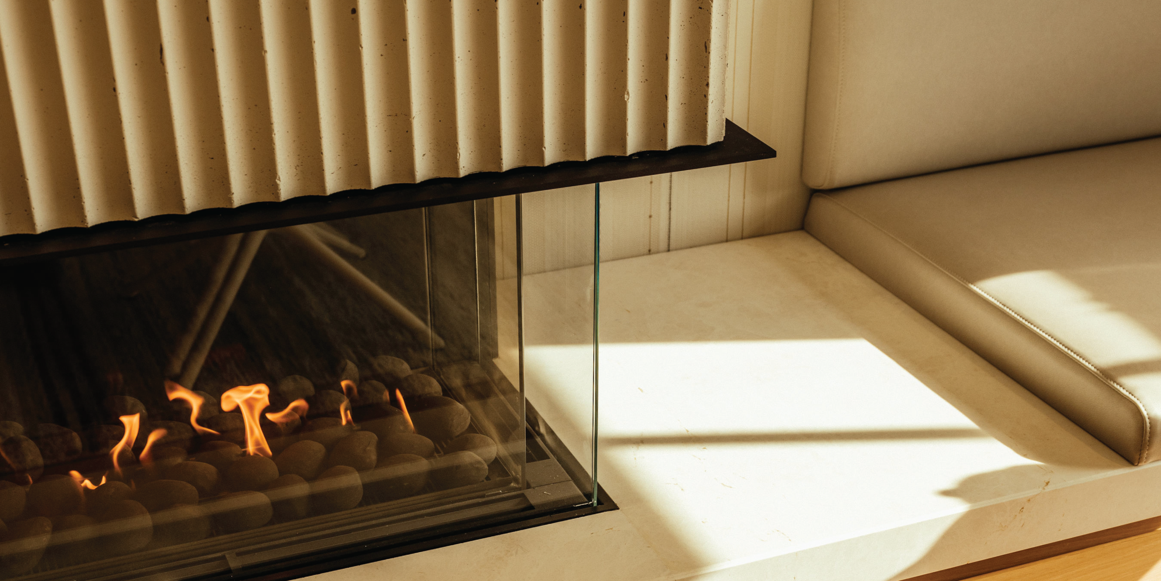 Sun streaming on the Empire room fireplace